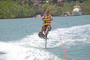 Hobbies: Man riding above water on air chair