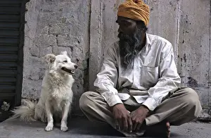 Headdress: Man sitting watching his dog Amritsar India