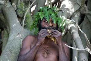 Vanuatu: Man from Tanna Island, Vanuatu, playing bamboo