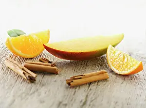 Arranged: Mango, Mangifera indica. One slice arranged with