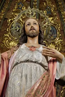 Religion: Marbella, Spain. Statue of Jesus on a gilded altar inside an