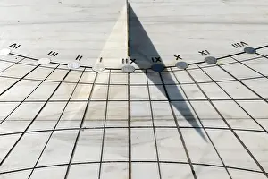 Shadow: Marbella, Spain. Sundial on a plaza in Marbella