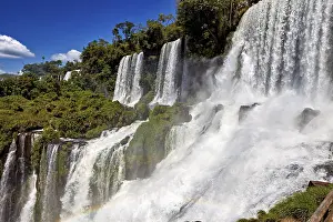Waterfalls: Massive waterfalls create dense spray and a rainbow
