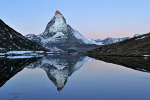 Riffelsee: Matterhorn with reflection Riffelsee at dusk sunrise