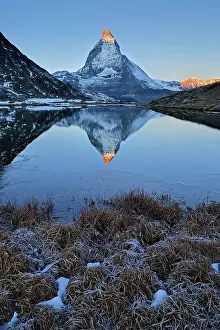 Riffelsee: Matterhorn with reflection Riffelsee at dusk sunrise