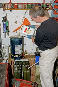 Chip: Mechanic in workshop making biodiesel from used