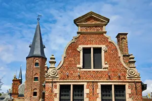 Brugge: Medievel tower and traditional roof decorations