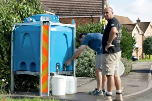 Containers: Two men collecting plastic containers of clean