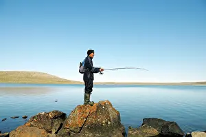 Inuit: Men of the Inuit people fishing in a lake, Victoria