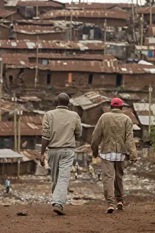 270917: Men walking in Kibera, one of Africa's largest