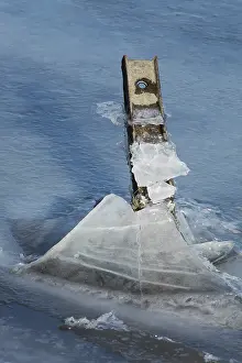 Sticking: Metal pole protrudes out of the ice, The Netherlands