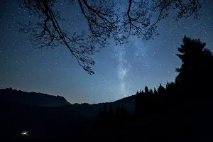 Astronomy: Milky Way over the mountains and forest at Schw&, x49e1;lp