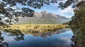 Fiordland: Mirror Lake with water reflections of the mountains