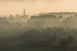 Limburg: Misty early morning landscape of a village and
