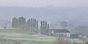 Timber: Misty early morning landscape of a village in t