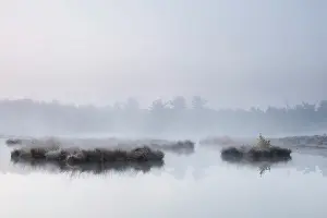 Vennen: Misty fen with small islands at sunrise
