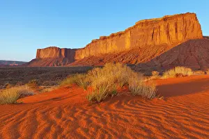 Tribal: Mitchell Mesa at sunset in Monument Valley