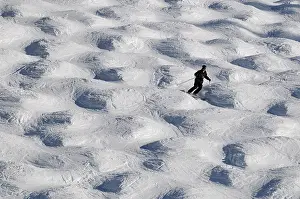 Backdrop: Mogul slope and skier in the ski region Telluride