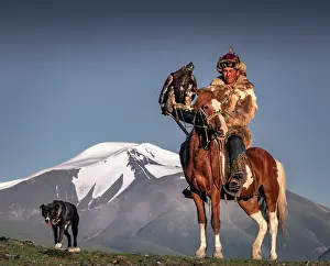 Obedient: Mongolian eagle hunter, Kazakh on horseback with