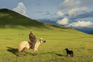 Steppes: Mongolian horseman and dog in the steppe - Mongolia
