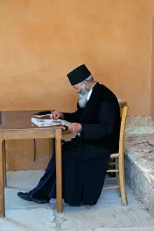 Monastery: Monk reading newspaper, Holy Trinity Monastery