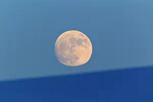 Moonlight: Full Moon - rising above hills