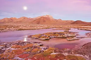 Salar: Full moon over thermal pool at edge of salt lake Salar de Su
