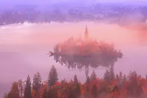 Church: Morning aerial sunrise view of Lake Bled with St