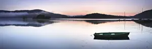 Boats: Morning atmosphere with fog over the lake, rowing boats