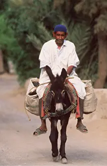 Riding: Morocco - Berber man riding donkey