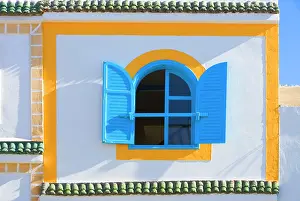 Houses: Morocco - brightly coloured house wall & window
