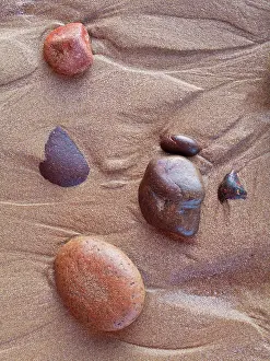 Ifni: Morocco - Pebbles in the sand at Legzira beach