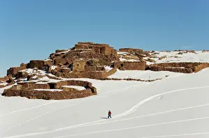 Skiing: Morocco - Snowed up Berber village and skier in