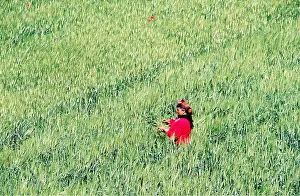 Weeding: MOROCCO - Spring (May), Woman taking weed out of cornfield