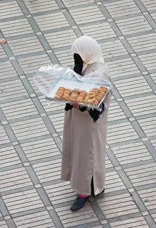 Marrakesh: Morocco - Woman selling cookies at Marrakesh's