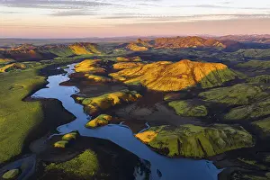 Mosses: Mossy landscape with river and mountains at sunrise