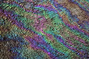 Motor: Motor oil creating rainbow pattern on pavement