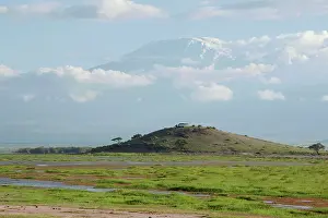 Kilimanjaro: Mount Kilimanjaro - snow covered peak above clouds