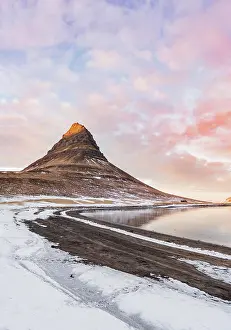 Pyramid: Mount Kirkjufell, cloudy sky with sunset, fjord