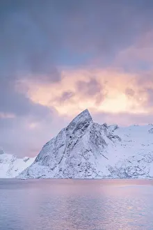 Hamnoy: Mount Olstinden in winter, snowy mountain by the