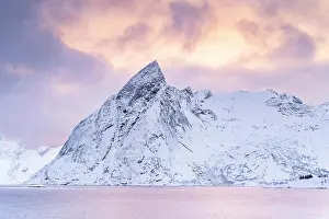 Hamnoy: Mount Olstinden in winter, snowy mountain by the