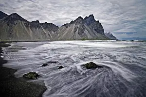 Vestrahorn: Mount Vestrahorn, black lava beach with surf at