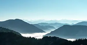 Breitenstein: Mountain chains one behind the other in back light