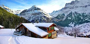 Huts: Mountain chalet in winter looking towards the Jungfrau