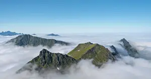 Protrude: Mountain landscape in clouds, view from the top