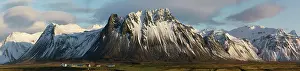 Vesturland: Mountain panorama with snow and a farm, near Langaholt