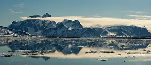 Longyearbyen: Mountain Range and clouds with Icebergs