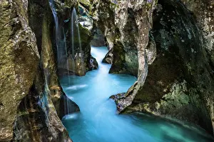 Flows: Mountain river Soca flows through narrow canyon