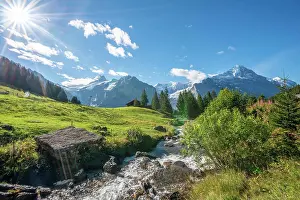 Eiger: Mountain stream in bright sunshine, snow-covered