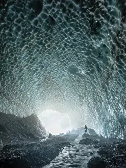 Berchtesgaden: Mountaineer in the ice chapel with meltwater stream